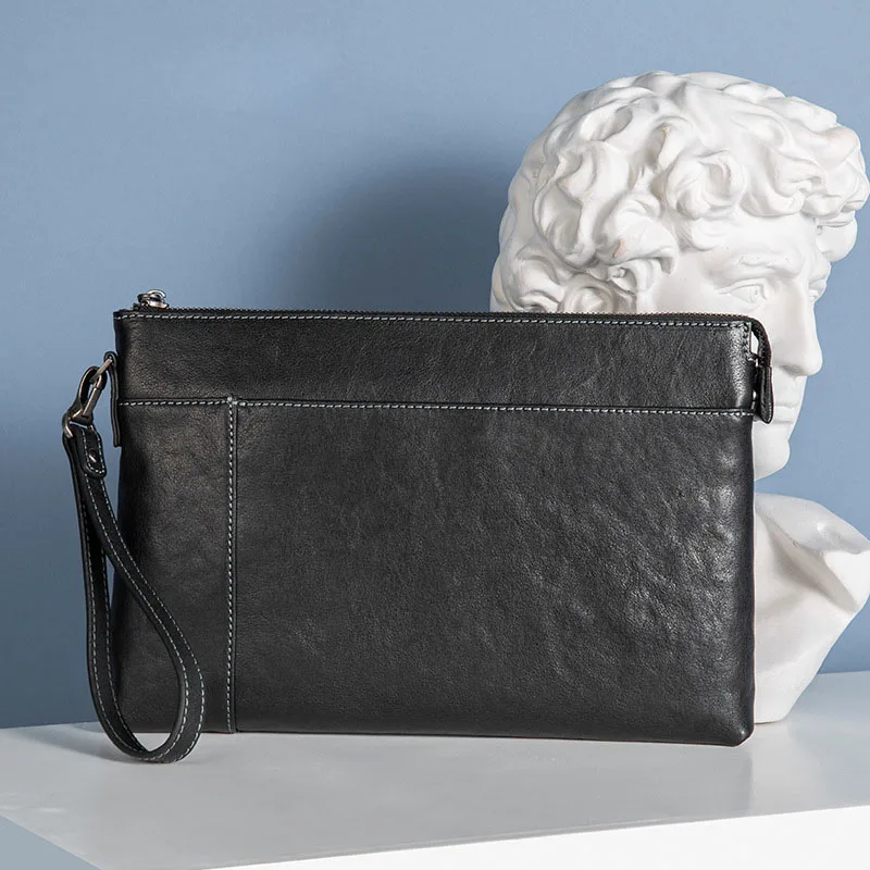 

AETOO The first layer of cowhide grip bag simple business casual hand men's bag leather envelope bag