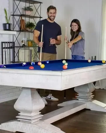 billiards table with people playing