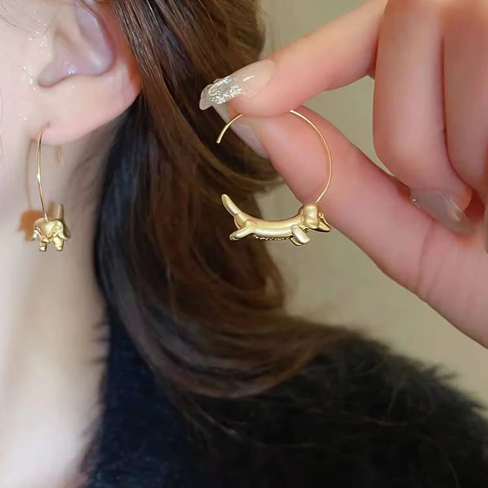 Cute Dachshund hoop earrings for women on satin background