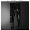 Winter plus velvet men's round neck casual suit fashion high-end embroidery crown eagle padded two-piece set 5