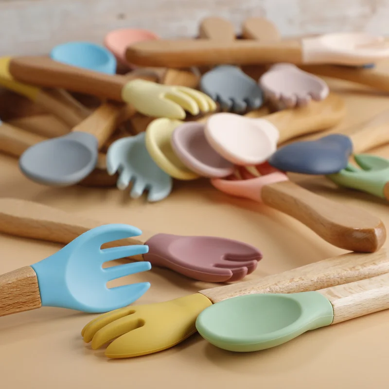 https://ae01.alicdn.com/kf/S16a119baecf74e2998f924f583116d33T/2pcs-set-Food-Grade-Silicone-Mini-Fork-Spoon-For-Baby-Wooden-Print-Utensils-Set-Feeding-Spoon.jpg