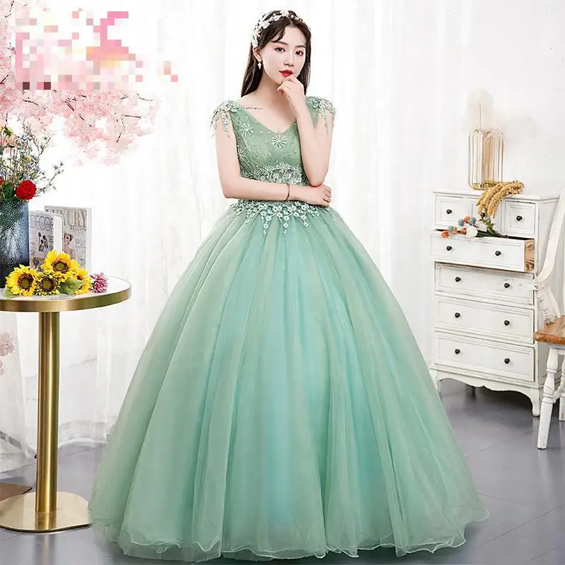 

Sexy Fashion Deep V-neck Quinceanera Dresses Green Illusion With Beading Vestido De Debutante Appliques Floor-length Ball Gown