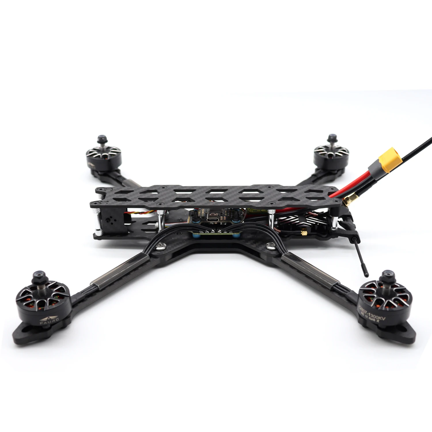 Drone FPV PNP avec ESC 60A, batterie connectée, détails des bras pliés pour le transport.