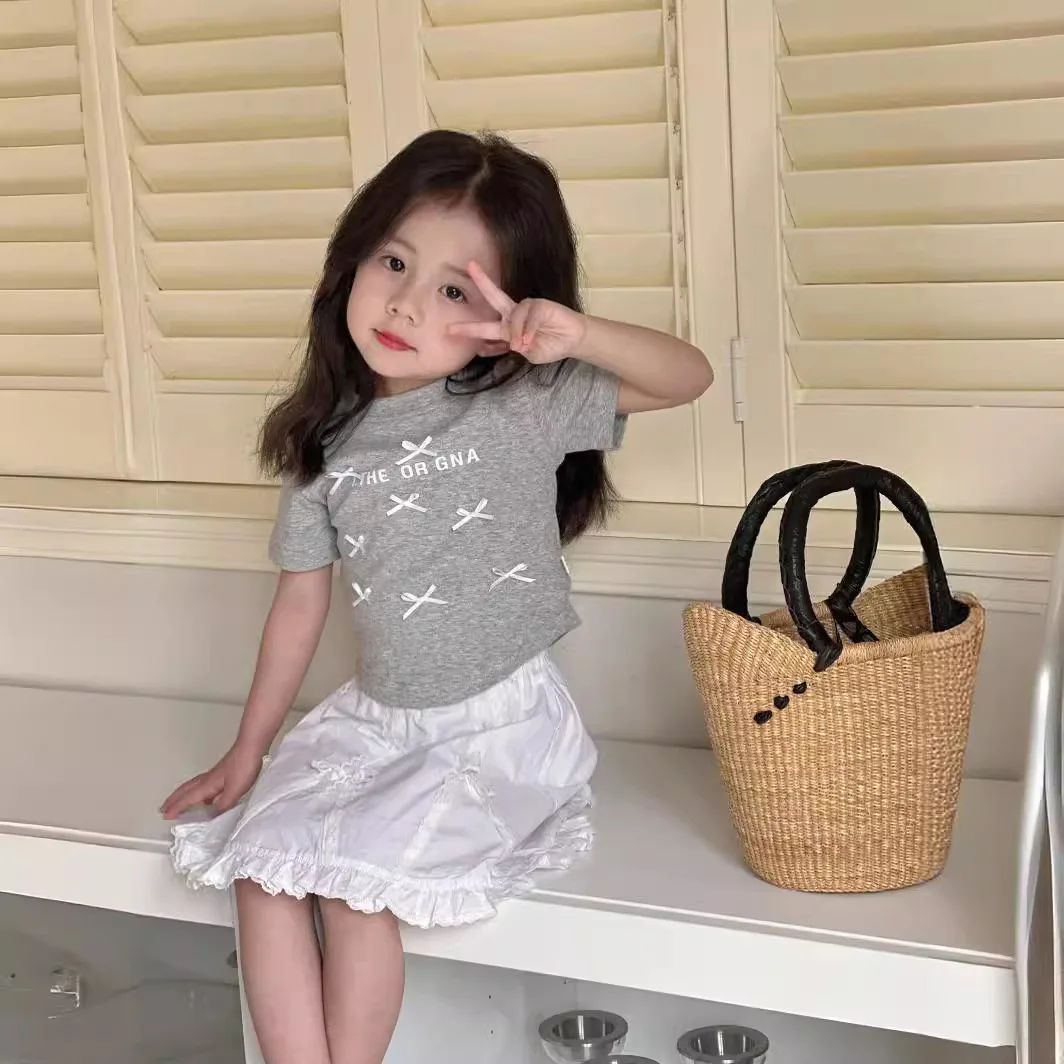 

Топ для девочек, футболка с бантом в Корейском стиле для девочек, облегающий топ для девочек в стиле специй, новинка 2024, летняя детская футболка с коротким рукавом и бантом, Повседневная