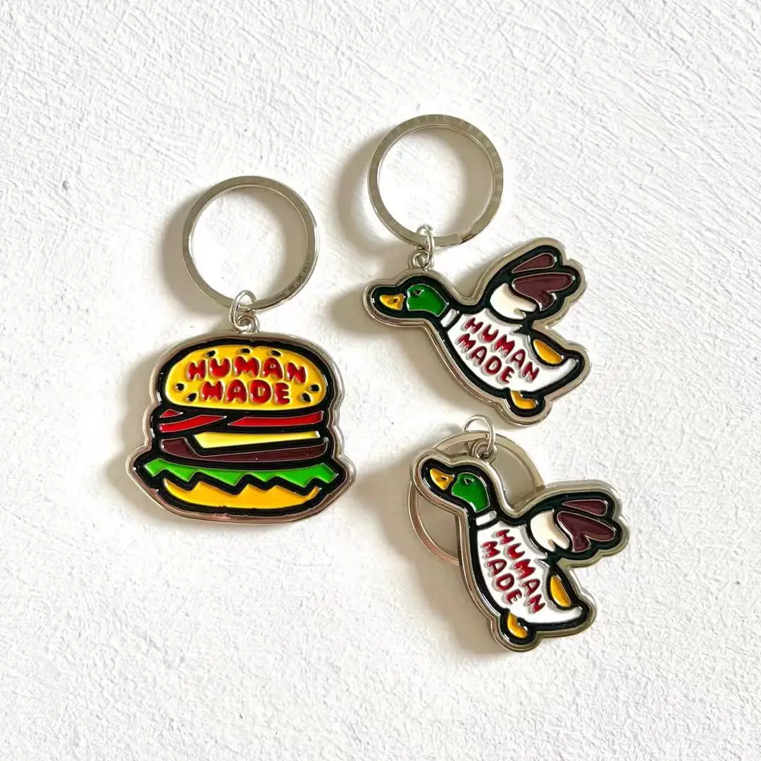 

Human style new Japanese versatile tide package accessories Flying duck burger couple cute metal keychain