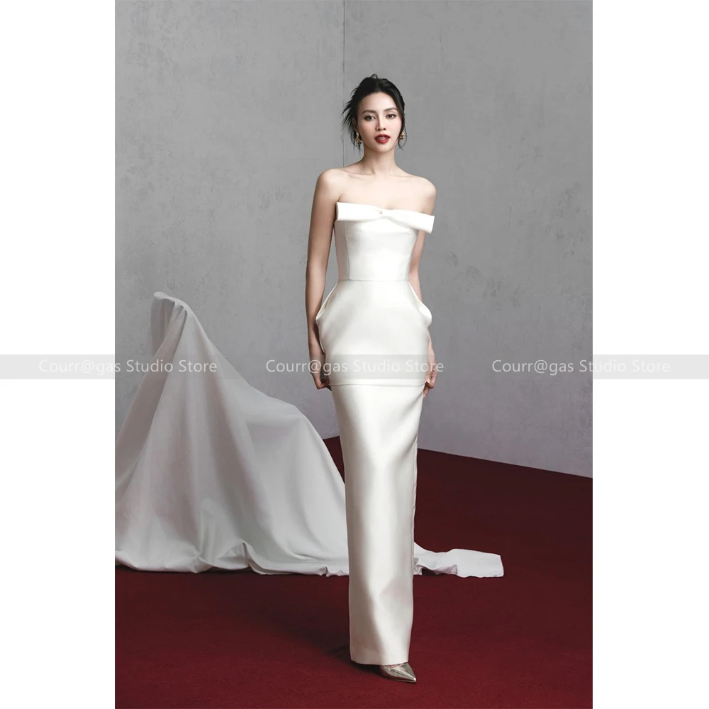 

Женское атласное платье с бантом и бусинами