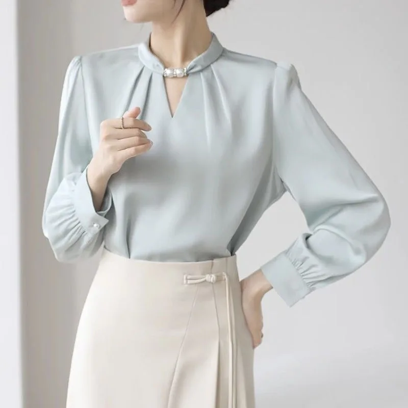 New Spring Fashion Korean Edition Trendy Design Sense V-neck Pearl Button Loose Versatile Slimming Long Sleeved Women's Shirt