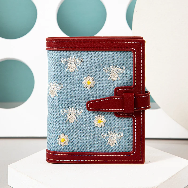 Women's short wallet 2021 new Korean version small fresh embroidery small wallet two fold draw belt multi card slot zero wallet