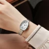 Ladies' exquisite and high-value Arabic numeral scale oval dial bamboo style steel strap quartz watch. 1
