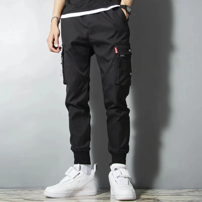 

American style high street outdoor pants with waterproof multi pocket work pants that can be used to tie the feet of paratrooper