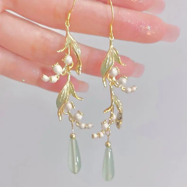 S17cfae841db74cfdab28188aa83c0052K Elegant White Orchid Flower Earring for Women Ladies Temperament Metal Leaves Long Tassel Drop Earrings Hook Jewelry Accessories Mallzona
