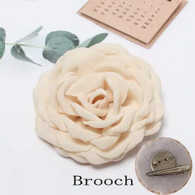 beige brooch
