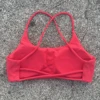 Soutien-gorge de yoga pour femme, couleur unie, à quatre bretelles croisées dans le dos, dos évidé, push-up, avec coussinets de poitrine, idéal pour le fitness et le sport