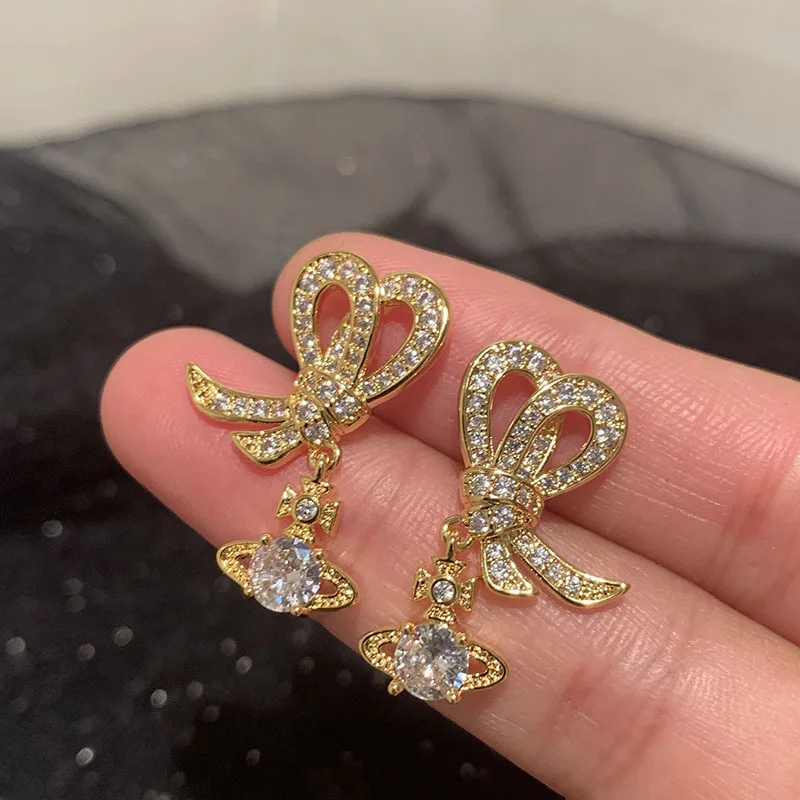 

Роскошные кружевные серьги-бантики билицветные для рождественского подарка