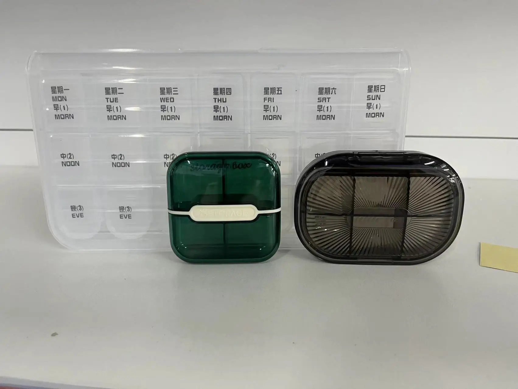 Multi color medicine box, portable for 7 days per week, with 21 compartments and 28 compartments for storage. Multi compartment