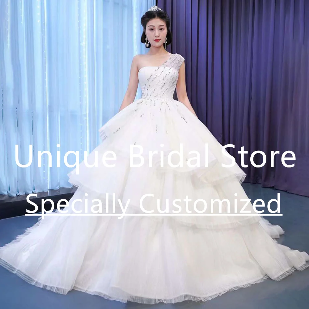 

Romantic Ball Gown Tulle Wedding Dress Beading One Shoulder Tiered Back Lace-Up Gorgeous Princess Brush Train Vestido De Noiva