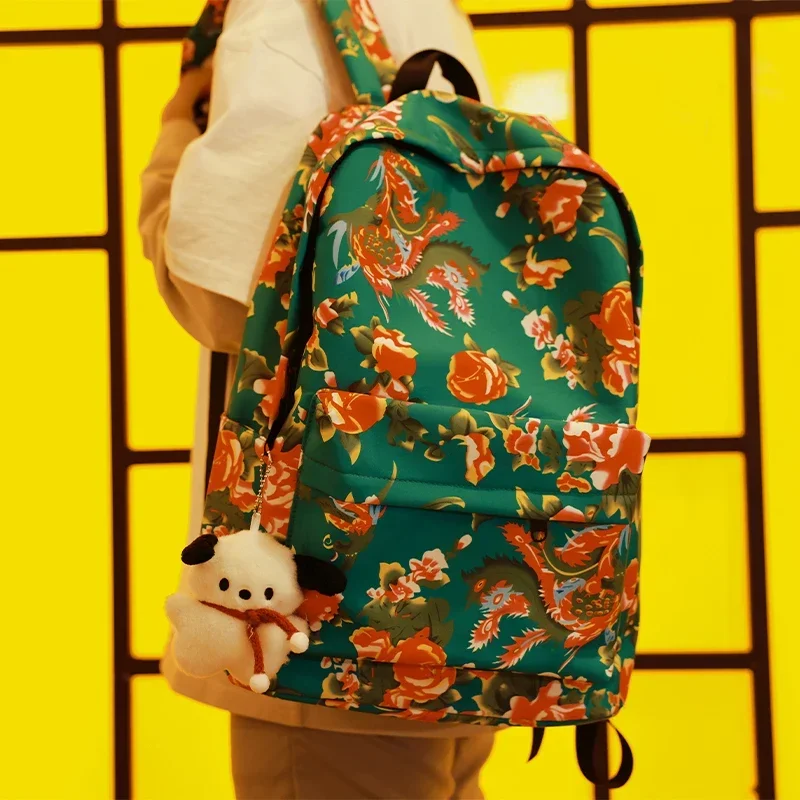 thumbnail image 1 of Mochila de lona con diseño de flores de estilo étnico, nueva y popular mochila de viaje unisex de gran capacidad, versátil y de colores contrastantes, 2024, 1 of 5