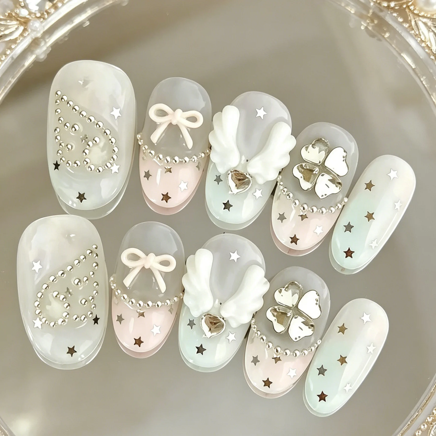 10 hand pressed oval shaped nails, beautiful fake nails, white green gradient angel wings, suitable for women to use