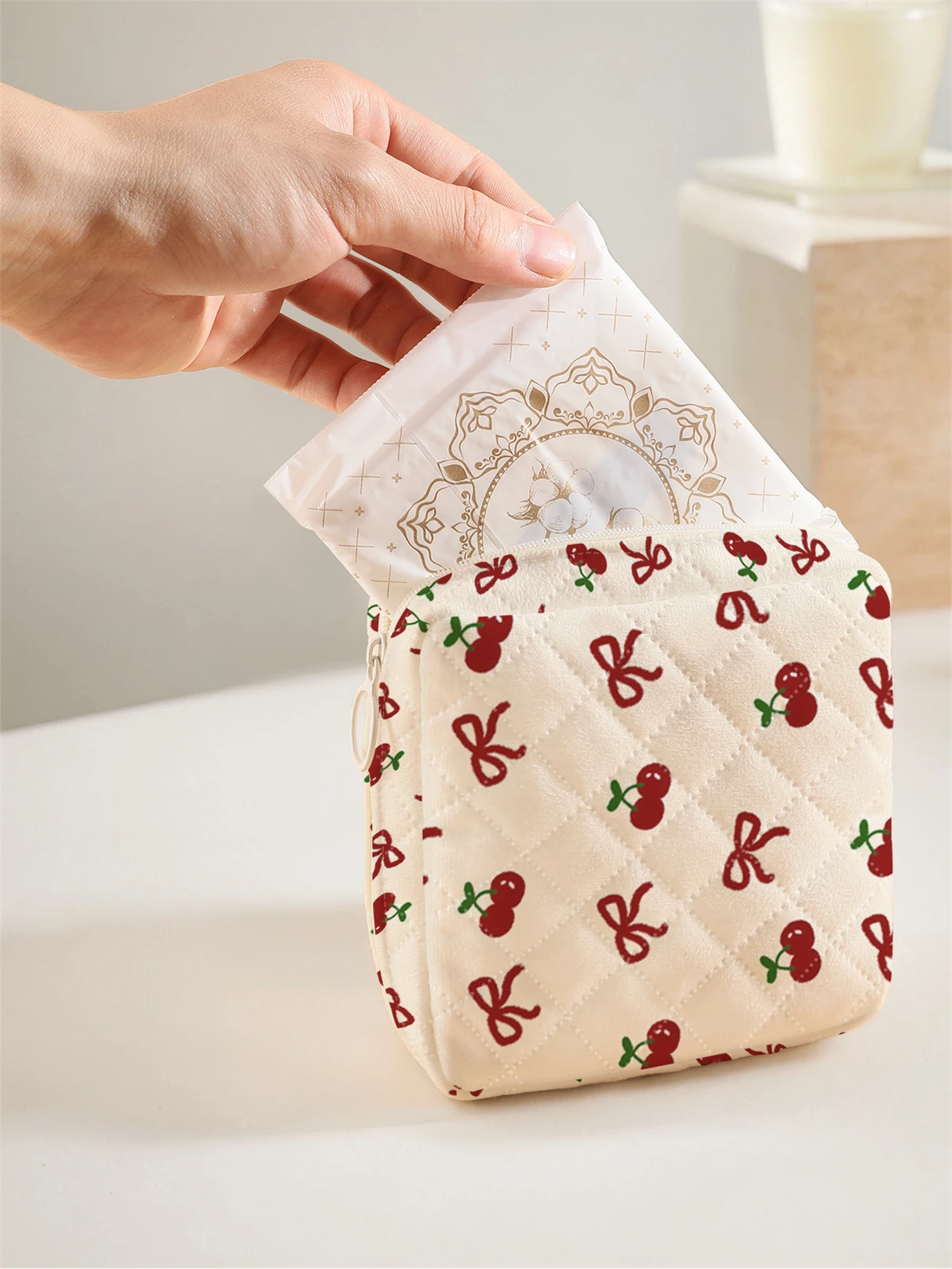 1 portable sanitary napkin storage bag with cherry bow pattern and diamond mesh material, lightweight women's tissue bag