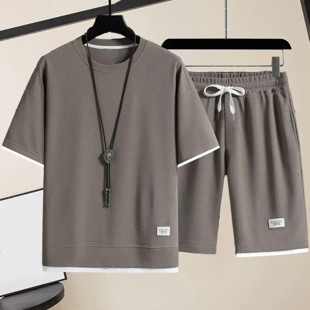 

2 Pcs/Set Men Summer Tracksuit Set Casual Loose T-shirt Shorts Set Solid Color Short Sleeves Elastic Waist Male Sports Outfits