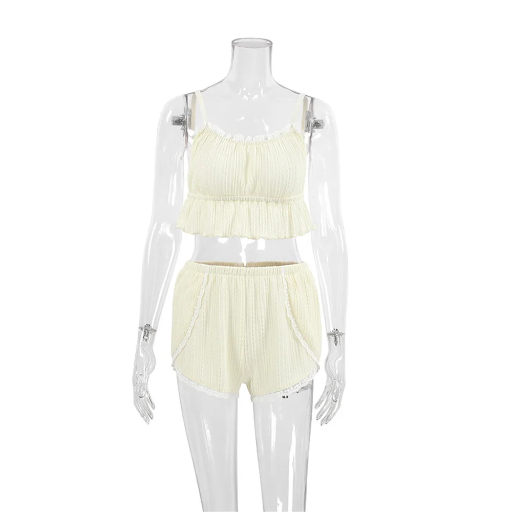 Camisole top detail with lace neckline, thin straps, and feminine sleepwear design