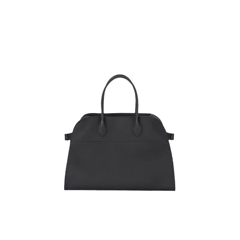 he Leather Tote bag is made of cowhide and designed for commuters, featuring a textured travel bag for women.