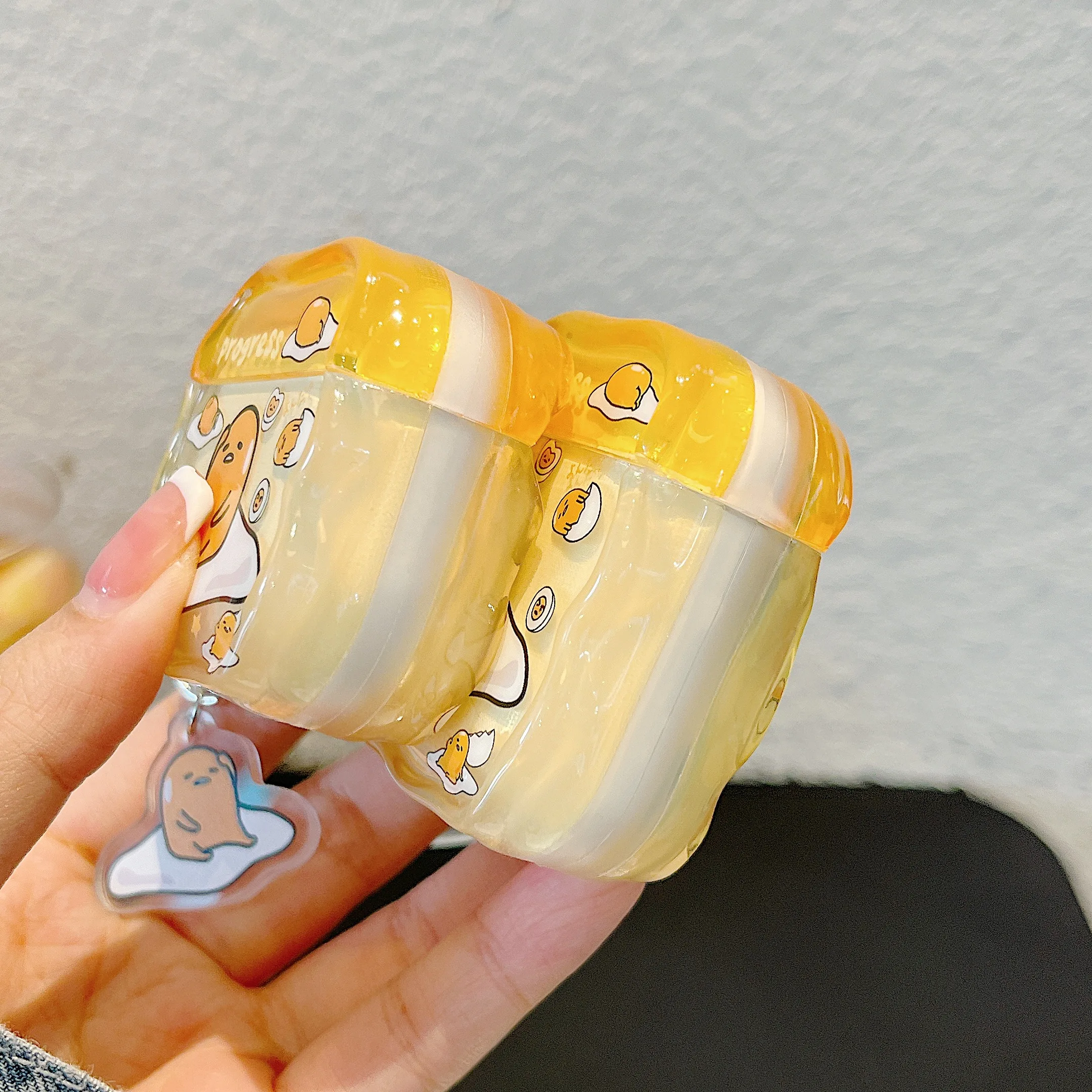 Charming Glossy TPU Earphone Case with Pendant - HelloKitty, MySweetPiano & Gudetama Design