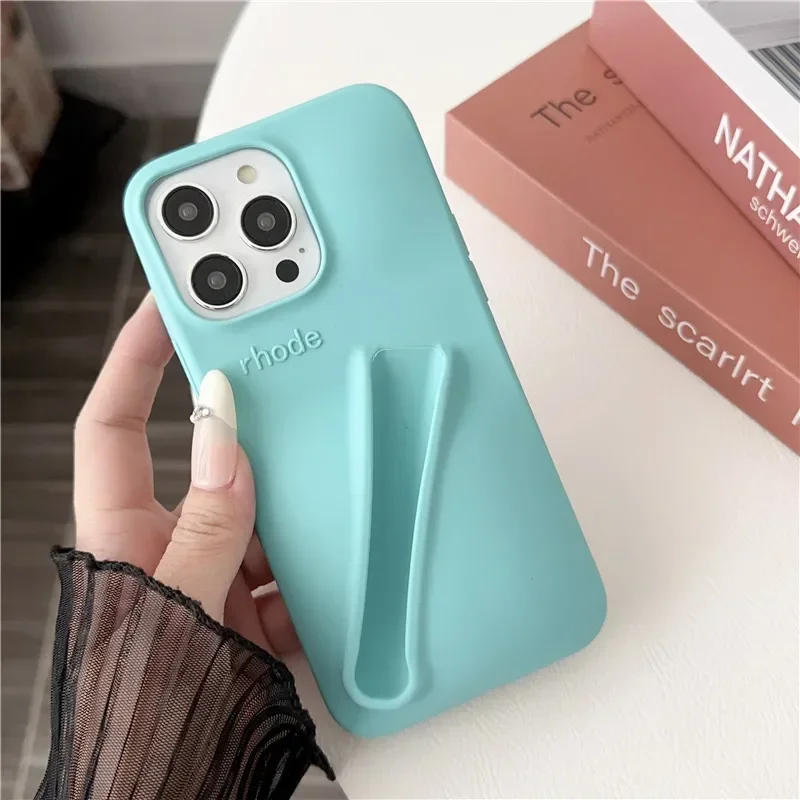 thumbnail image 1 of Estuche para teléfono de silicona suave con diseño de lápiz labial para iPhone 11, 12, 13, 14, 15 Pro Max, soporte portátil para brillo de labios Rhode Hailey, 1 of 5