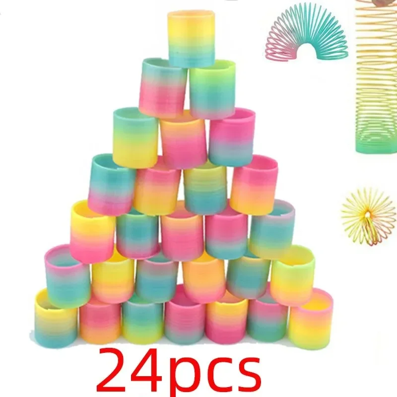 24PCS 레인보우 매직 스프링 서클 장난감 어린이 생일 파티는 손님을 선호합니다 경품 작은 선물 Pinata 필러 유연한 재미 있은 장난감