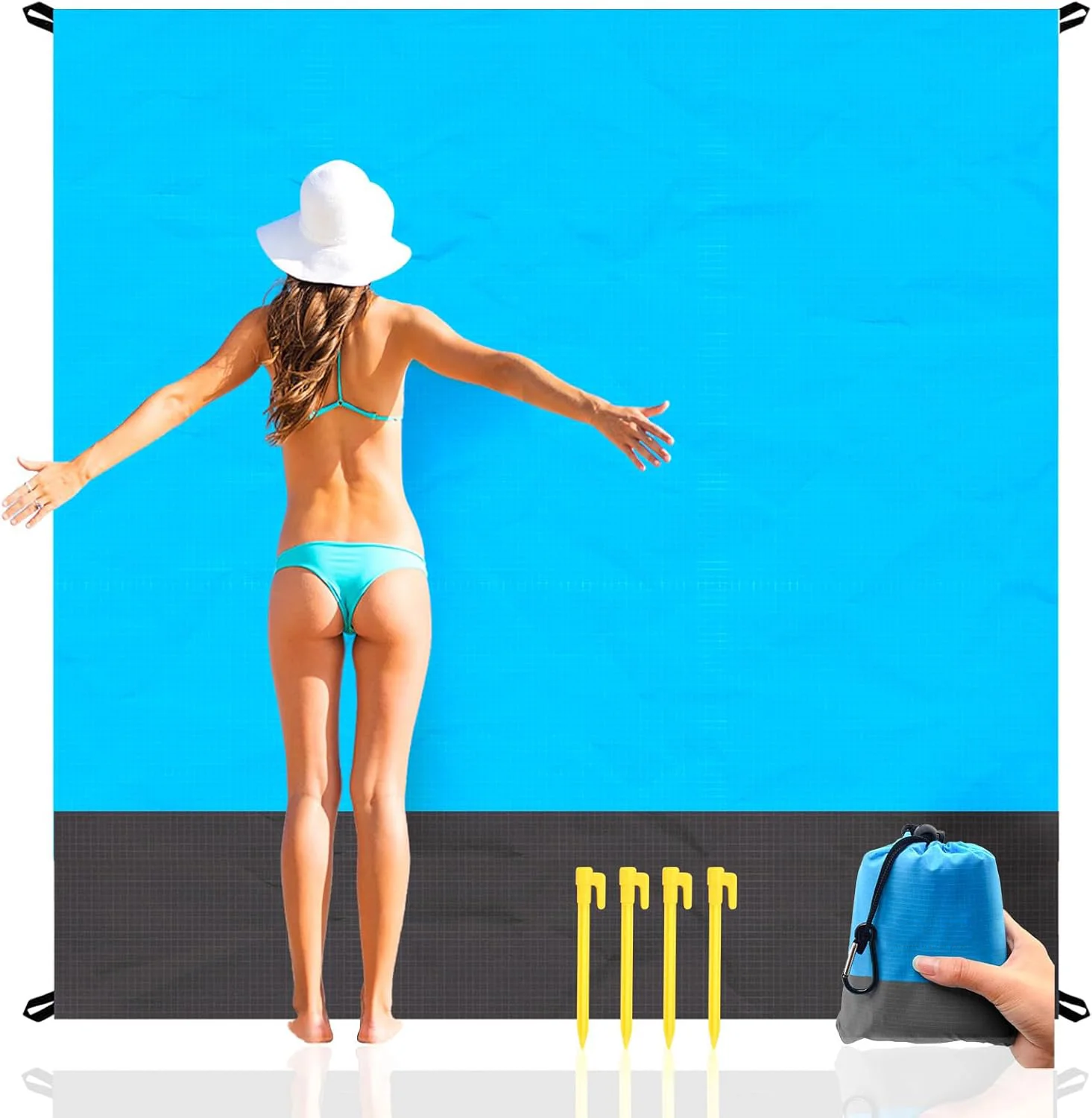 Family sitting comfortably on beach blanket