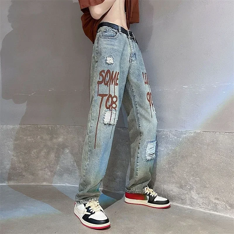 thumbnail image 1 of Pantalones vaqueros para hombre rotos con agujeros Pantalones rectos rotos Pantalones vaqueros masculinos Hip Hop Estampado Desgarrado Elegante Suave Casual Moda 2024, 1 of 4