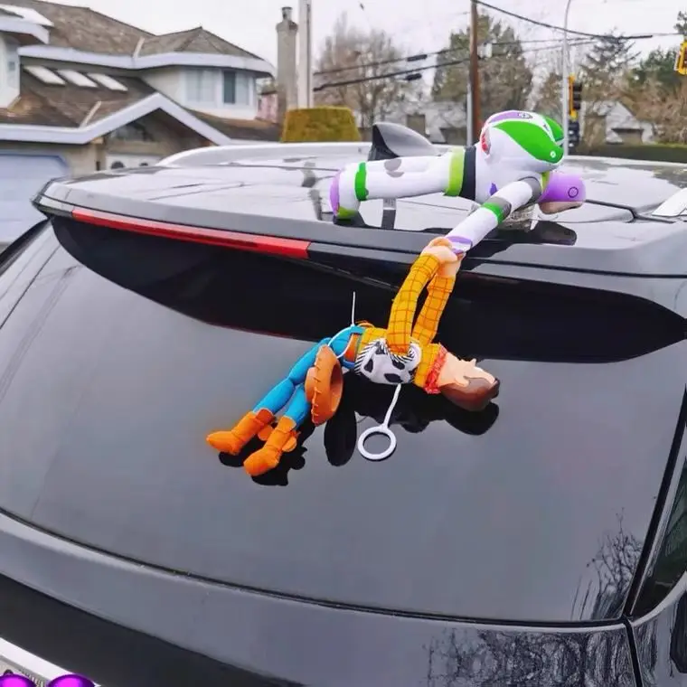 ToyStory Woody plush toy displayed inside a car