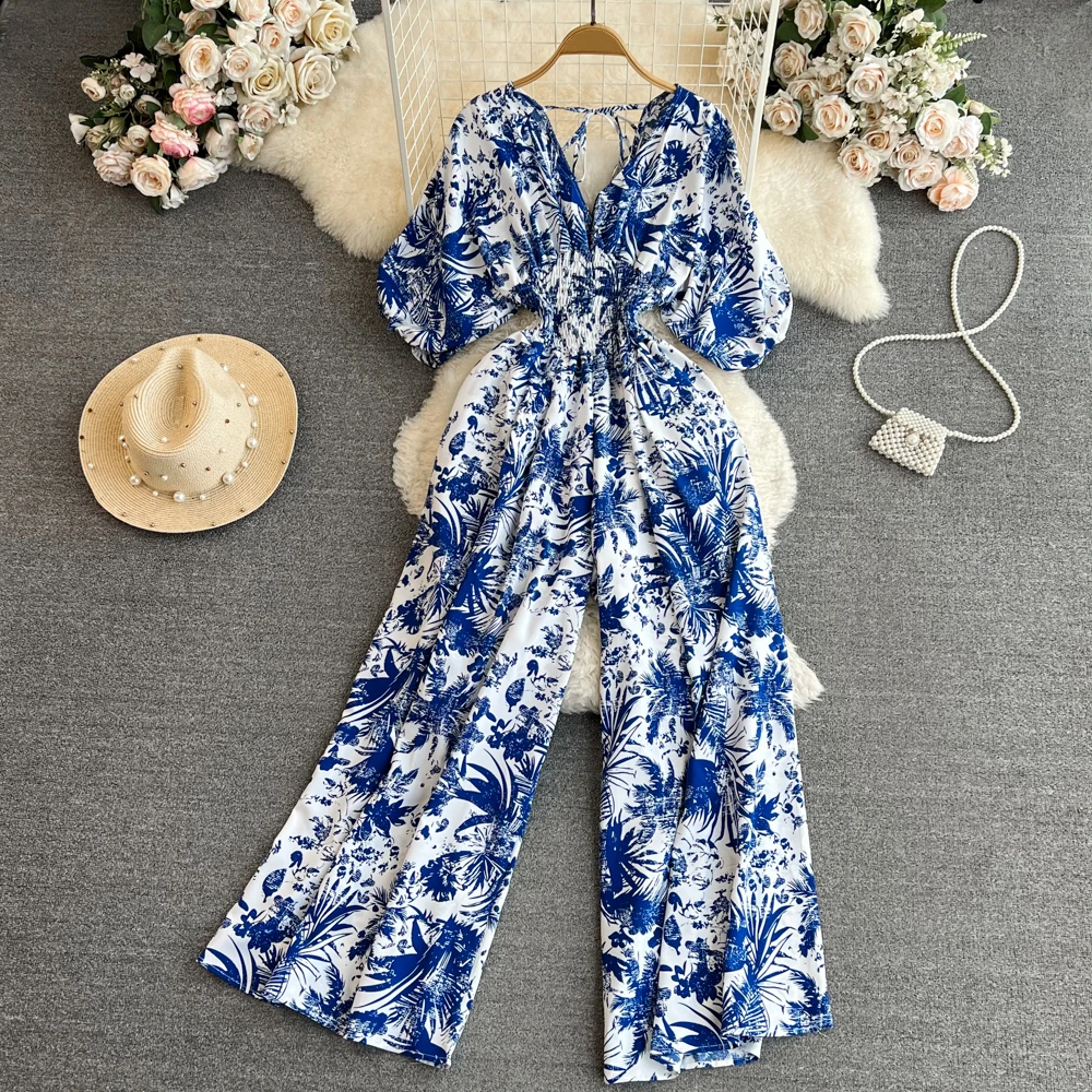 

Clothland Women Elegant Print Jumpsuit V Neck Short Sleeve Elastic Waist One Piece Retro Summer Playsuits Mujer KA354