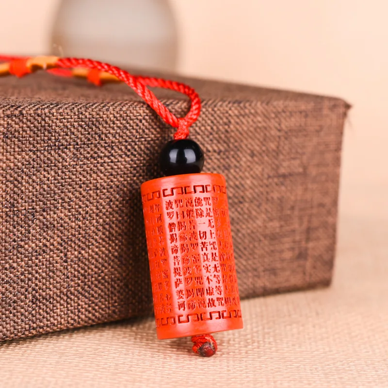 

Increase your good luck Pendant with a straight barrel bead pendant of imperial sand and a sutra spinner