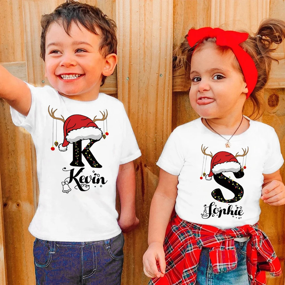 thumbnail image 1 of Camisetas navideñas personalizadas con nombre e iniciales personalizadas, ropa infantil de manga corta, camiseta para niños y niñas, atuendo de fiesta, camiseta para niños, 1 of 5