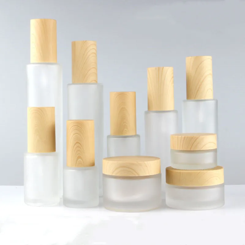 

Frosted Glass Empty Jar Pot Spray Bottle Cosmetic Face Cream Lotion Containers Plastic Wood Grain lid Travel Refillable Bottle