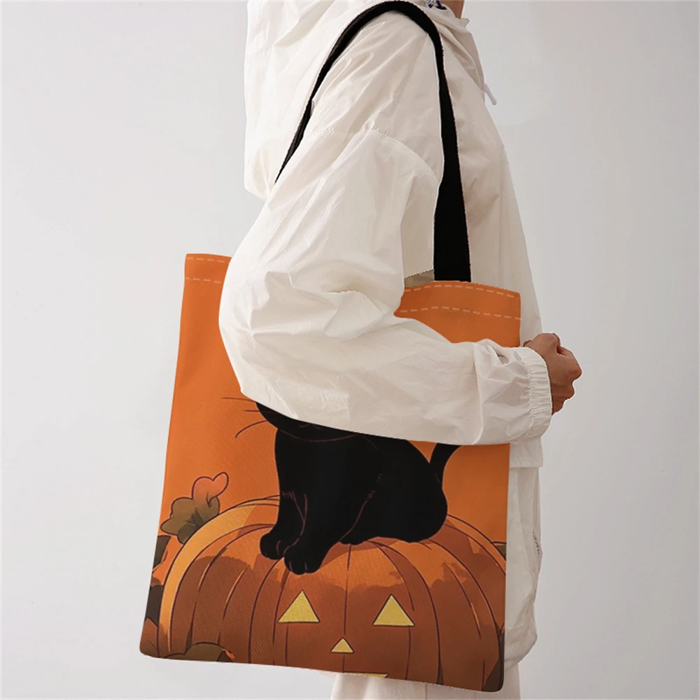 Black cat pumpkin pattern printed casual handbag, reusable fashionable backpack, multifunctional handbag, canvas shopping bag