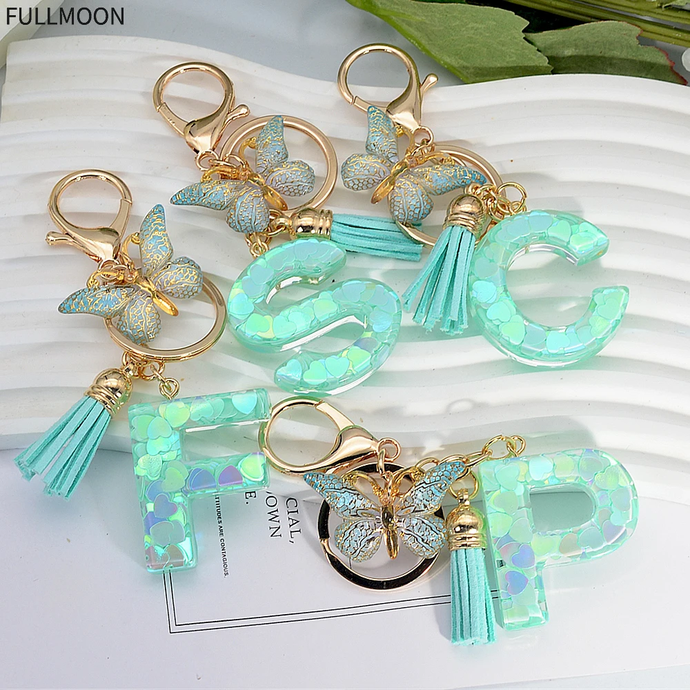 JSRQT Llavero De Letra Inicial Personalizado De Resina, Nombre Llavero Rosa Regalo Con Colgante De Mariposa Y Flecos Para Mujeres Niñas (A