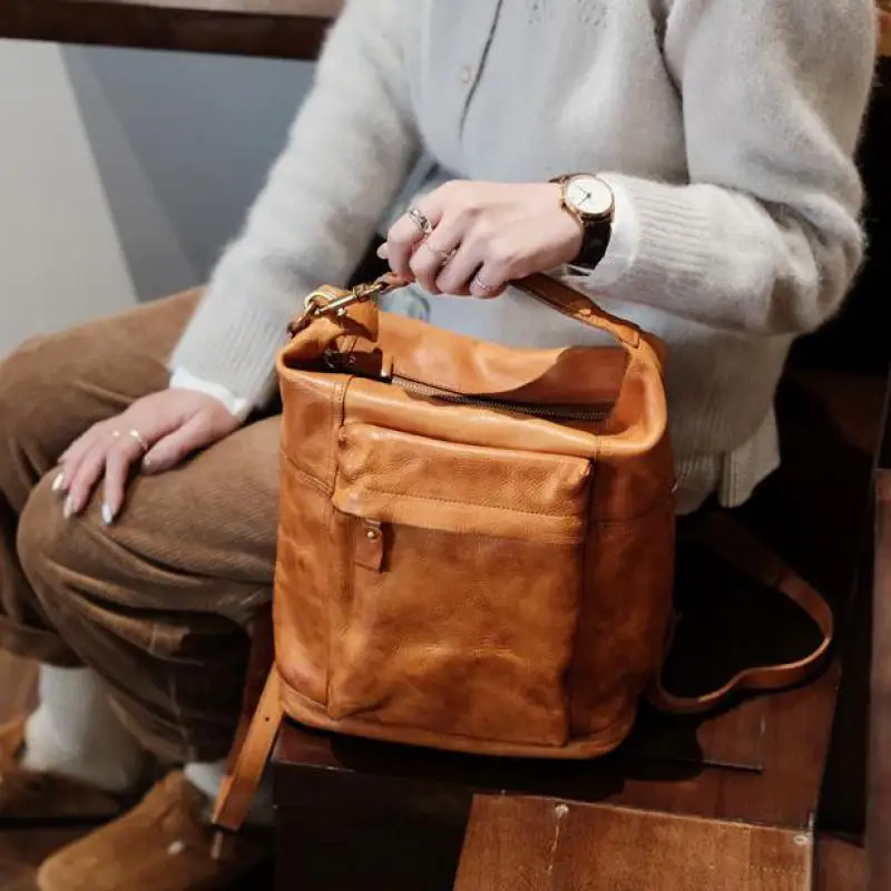 

High Quality First Layer Cowhide Bucket Handbag Retro European / American Fashion Personalized Commuting Backpack For Women Tide