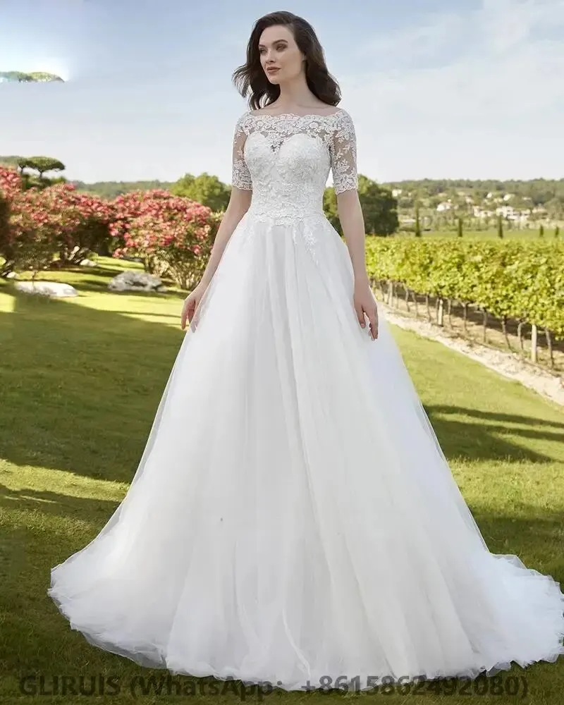 abiti-da-sposa-con-scollo-a-barca-appliques-di-pizzo-mezza-manica-lllusione-indietro-abito-da-sposa-tulle-court-trian