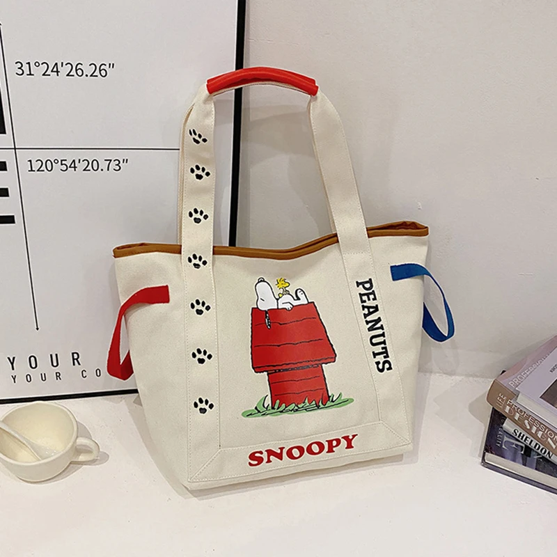 thumbnail image 1 of Bolso de lona de gran capacidad con dibujo animado de Disney Snoopy de MINISO, bolso de hombro para estudiantes, bolso de mano con estampado lindo, 1 of 5