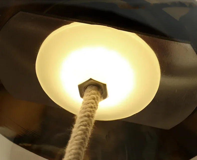 LED bulb glowing inside pendant lamp