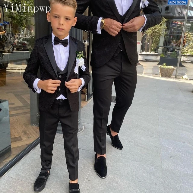 13 Looks That Prove Black Suits Are Back | Boys black suit, Black suit men, Black  suit combinations