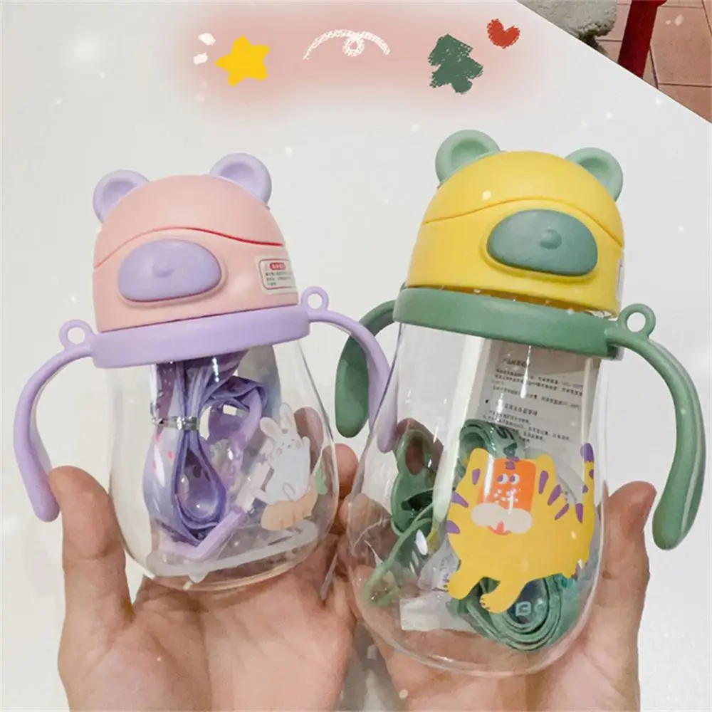 https://ae01.alicdn.com/kf/S1d06f21ea4a24561b57b741dd1949c09B/Children-s-Water-Cup-Cute-Cartoon-Baby-Bottles-Drinking-Cup-Baby-Feeding-Cup-With-Scale-Kids.jpg