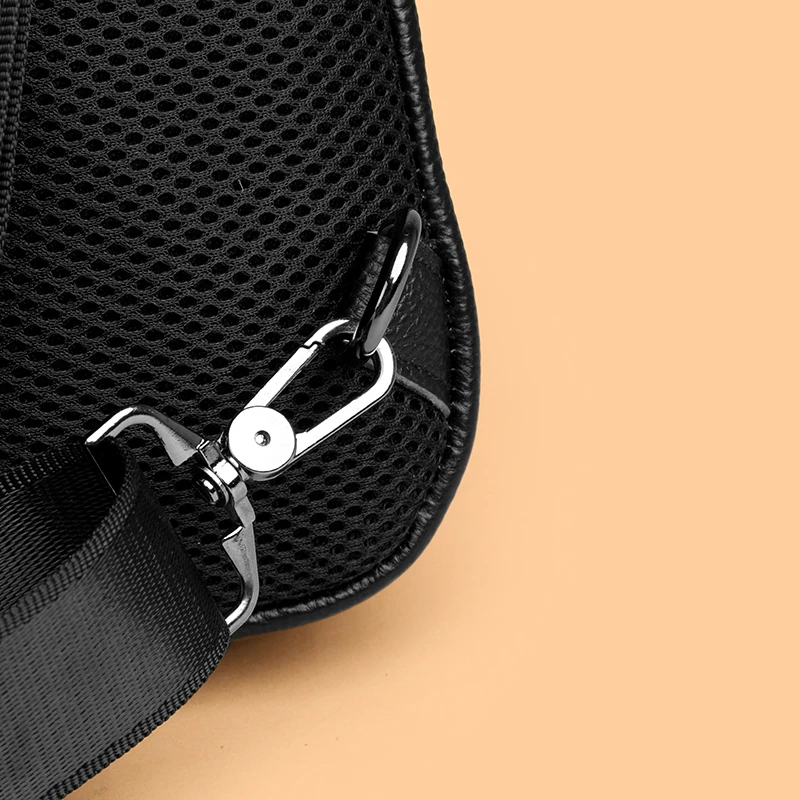 Stylish genuine leather sling bag for men with multiple compartments, ideal for everyday carry or travel