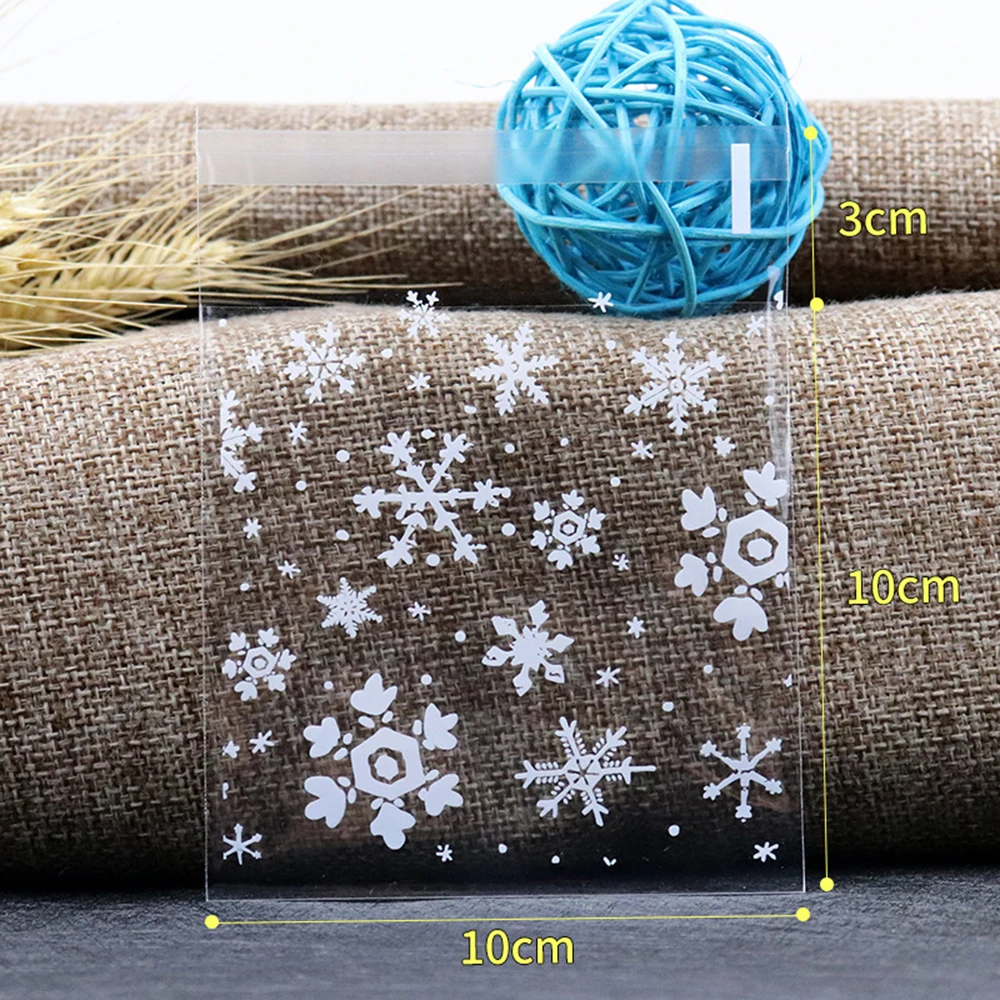 MELLIEX 100pcs Navidad Bolsas De Celofan, Bolsas De Copo De Nieve Para Chuches Galletas Bolsa De Dulces Navideños Con 100 Lazos Retorcidos(27x13cm Y 20x10cm