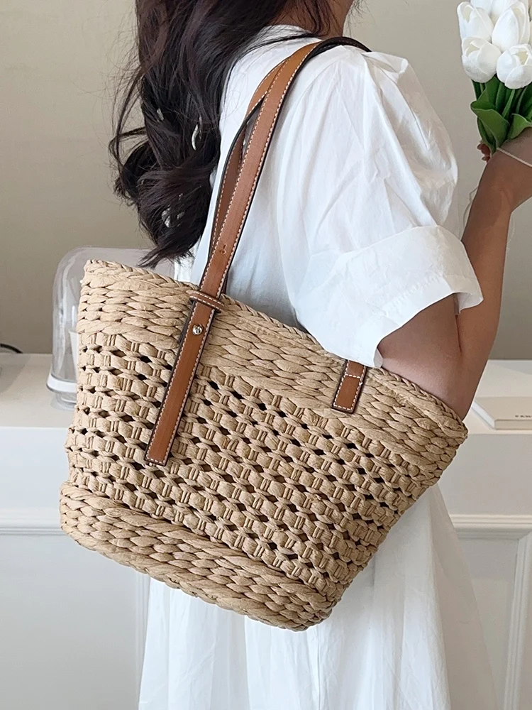 

2023 Summer Handmade Grass Beach Handbag Women's Vintage Hollow Handbag Basket Latan Vacation Shoulder Bag