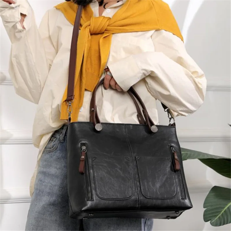 Retro leather handbag with two zipper pockets, versatile tote and crossbody style, classic women’s work and business bag. black