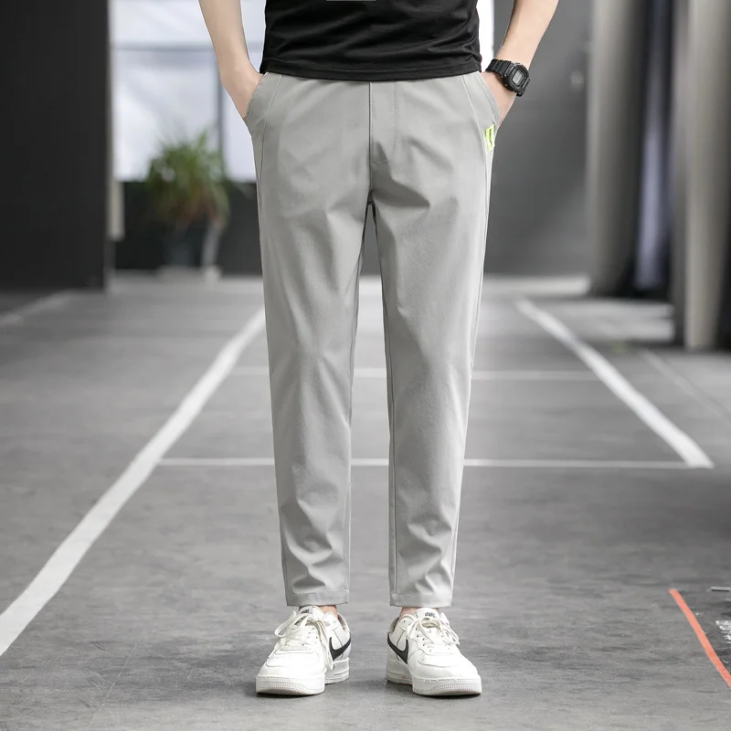 Men's Spring Autumn Elastic Casual High Waist Solid Pockets Letter Patch Casual Harlan Feet Trousers Cargo Office Lady Pants