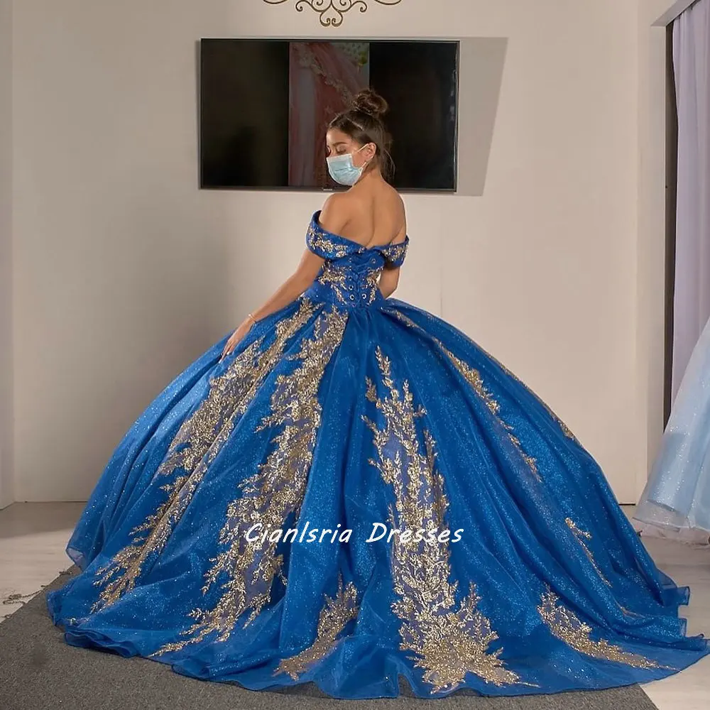 

Royal Blue Off The Shoulder Open Back Ball Gown Quinceanera Dresses With Gold Crystal Appliques Short Sleeve Vestido De 15 Anos